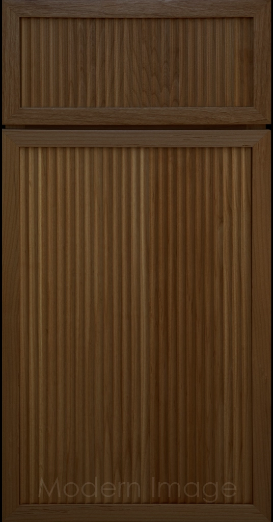 Modern kitchen featuring Arcadia Cove Cognac stained cabinets with narrow frames and fluted center panels
